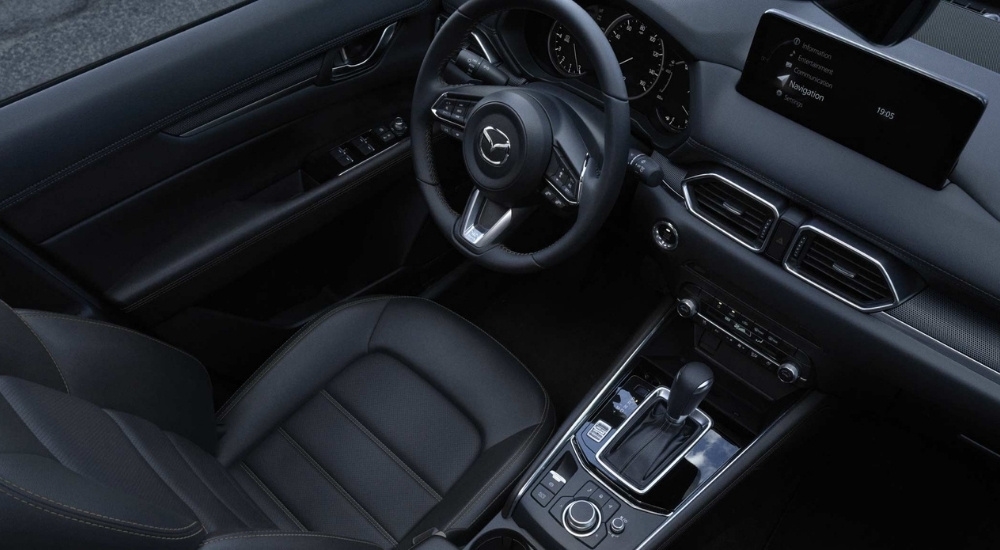 The black interior in a 2025 Mazda CX-5 for sale.