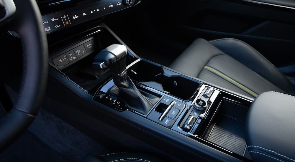 Close-up on the shifter and temperature controls in a 2025 Kia K5.