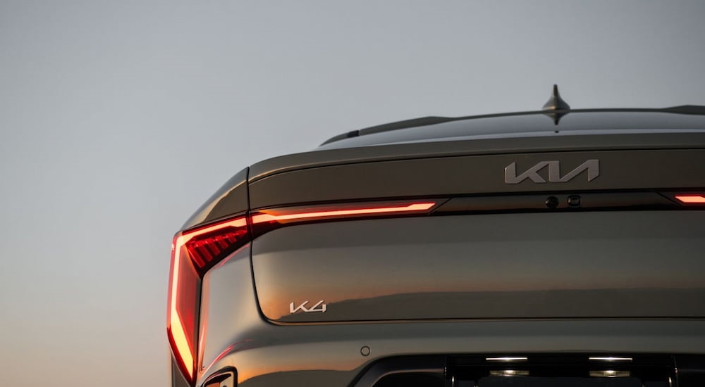Close-up on badge and rear of a grey 2025 Kia K4 for sale near Houston.
