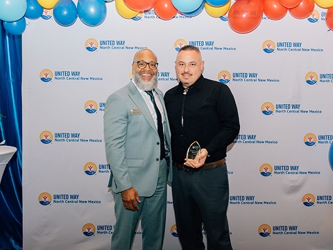 Mike Michnuk accepting the 2024 United in Purpose Award from United Way of North Central New Mexico