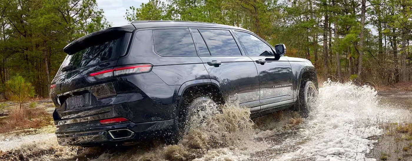 A grey 2025 Jeep Grand Cherokee from the front at an angle.