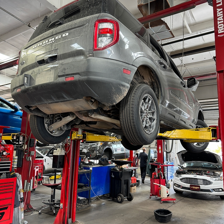 a Ford Bronco Sport SUV getting its tires serviced at the Chalmers Ford service center in Albuquerque, NM