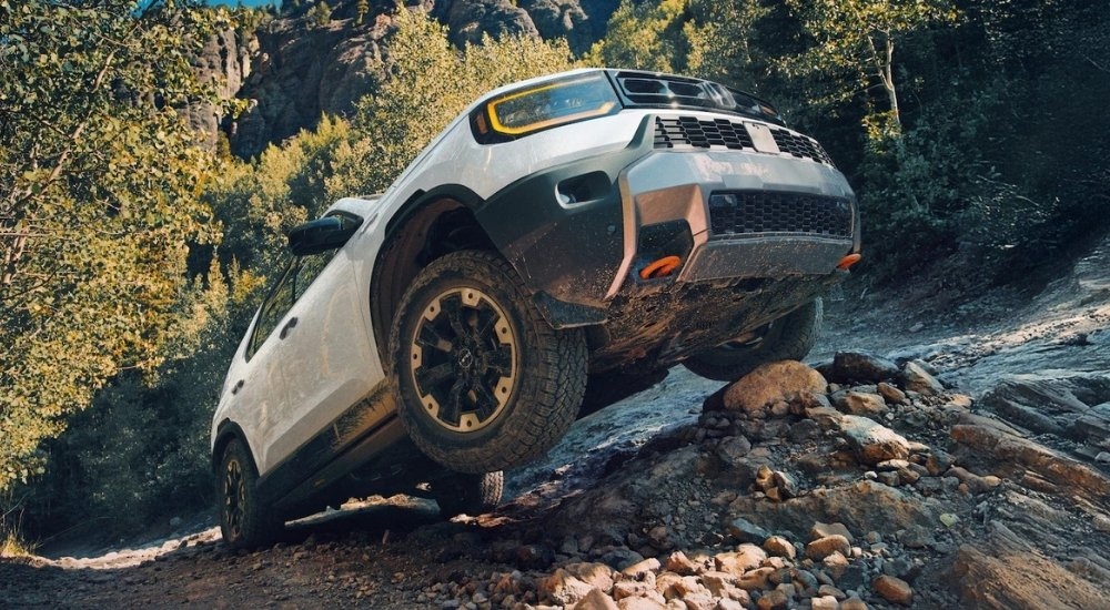 A white 2026 Honda Passport TrailSport Elite HPD parked off-road.