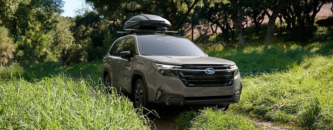 A grey 2025 Subaru Forester on a trail.