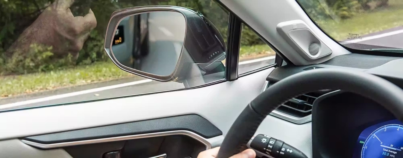 Blind spot monitoring icon on a 2023 Toyota RAV4.