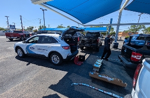 the Chalmers Ford mobile service tech parked in a lot performing maintenance