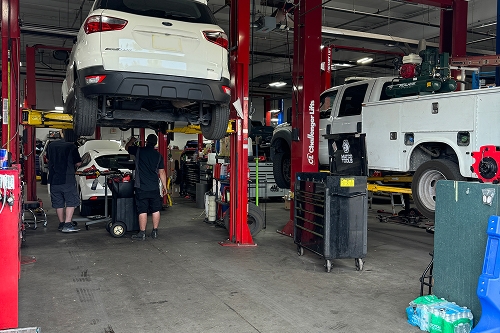 person getting an oil change at the Chalmers Ford service center in Albuquerque, NM