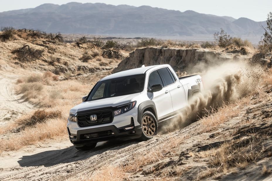 A Honda Ridgeline driving off-road through the desert