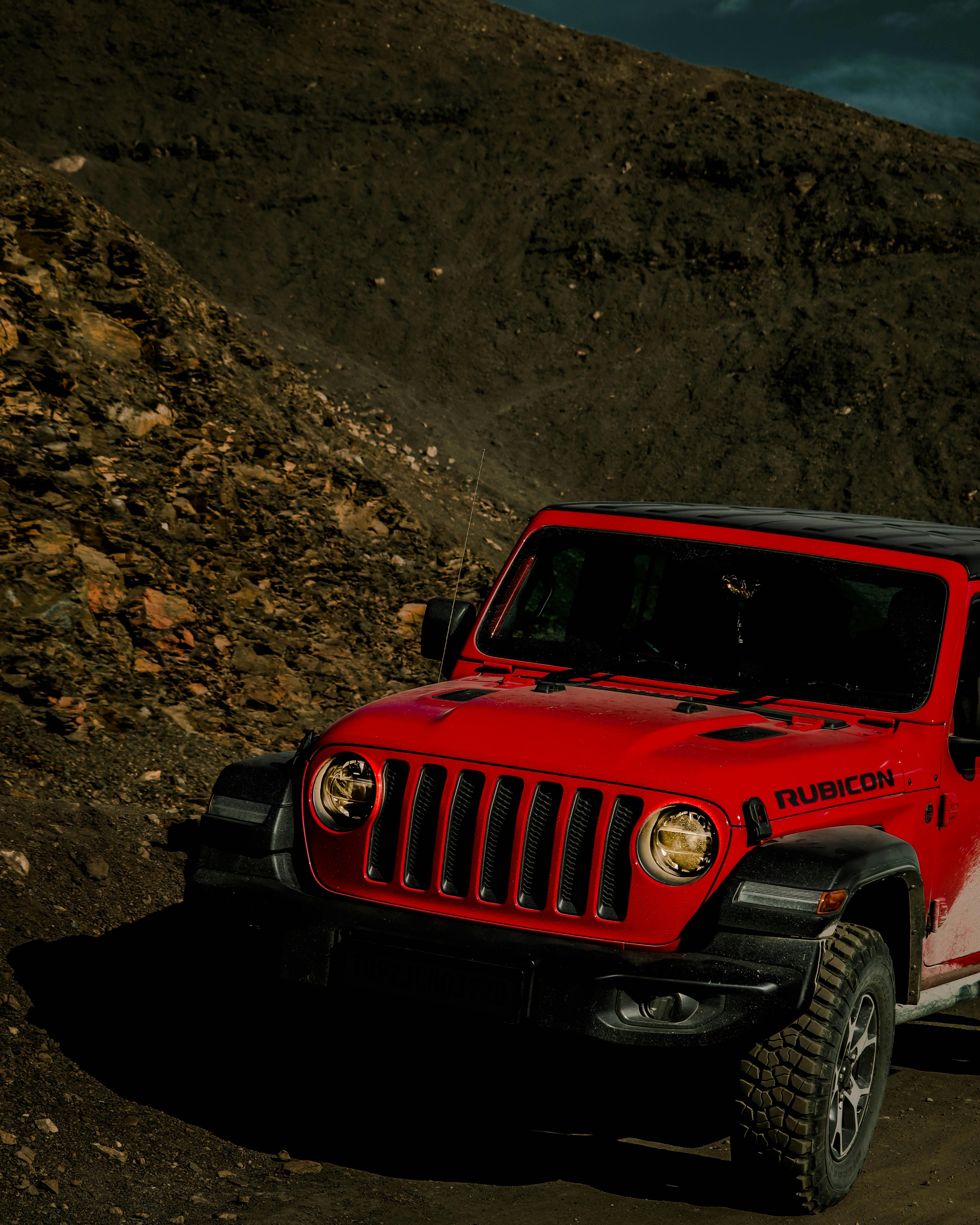 A Jeep Wrangler Rubicon driving up an offroad trail