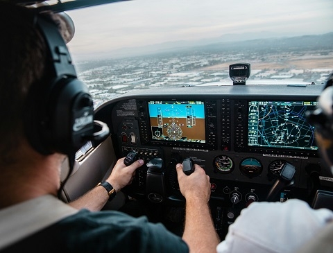 person piloting an airplane at a flight school in mission viejo, ca