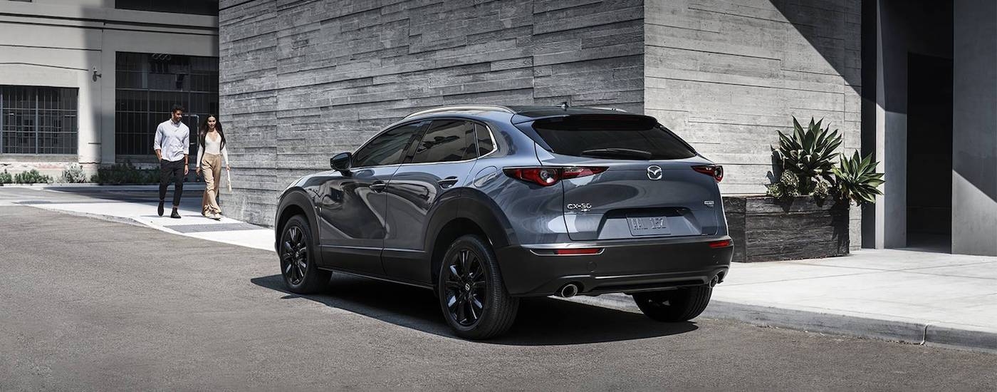 A grey 2023 Mazda CX-30 from the rear at an angle after leaving a dealer that has a used Mazda for sale near Hollywood.