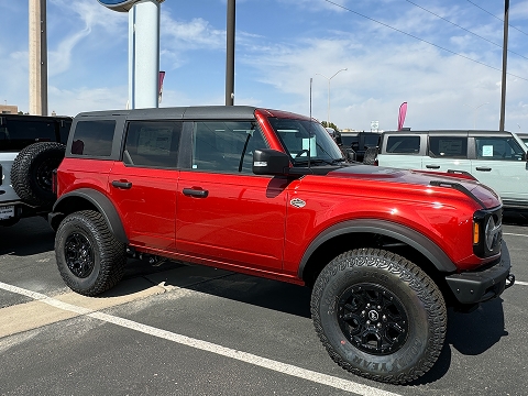 red 2025 Ford Bronco SUV parked at the Chalmers Ford dealership in Albuquerque, NM
