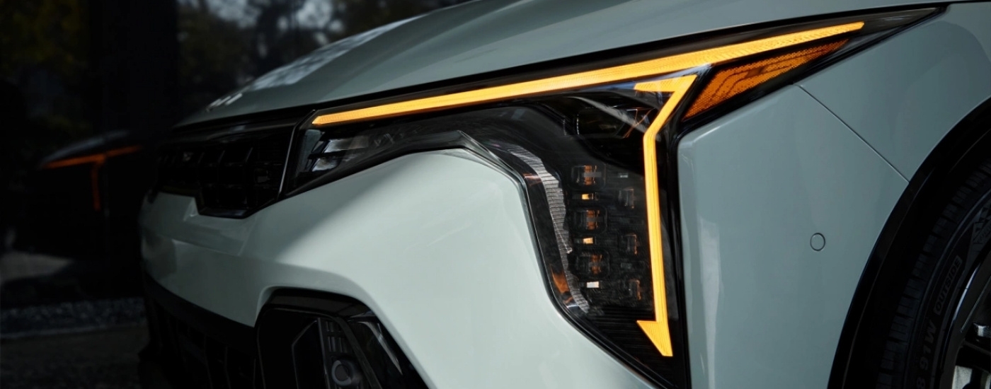 Driver side headlight on a white 2025 Kia K4.