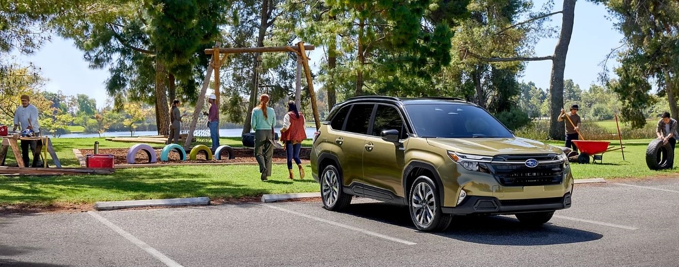 A green 2025 Subaru Forester from the front.