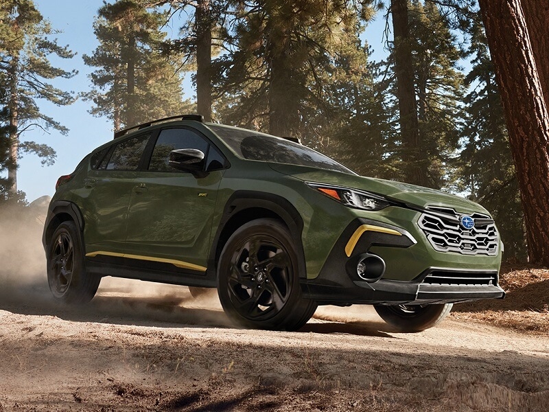 Subaru Crosstrek on a Dirt Road in the Forest