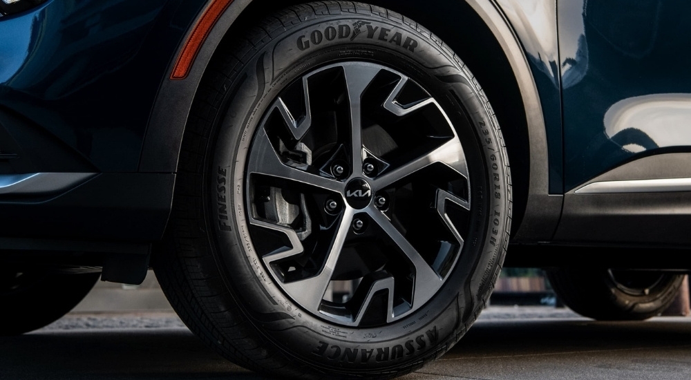 Wheel on a blue 2025 Kia Sportage EX.
