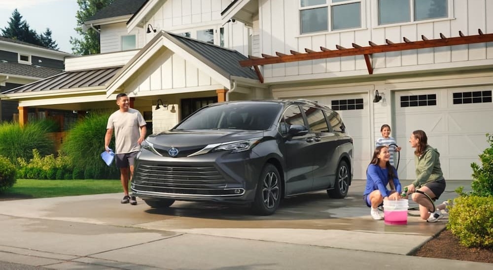A gray 2025 Toyota Sienna for sale parked on a driveway.