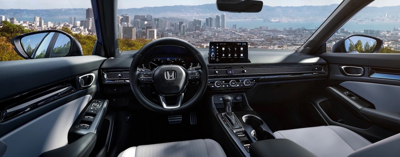 The black interior of a 2025 Honda Civic for sale.