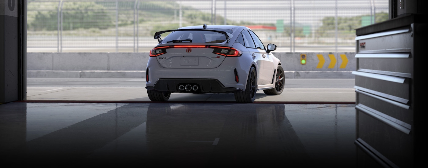 A white 2025 Honda Civic Type R from the rear at an angle.