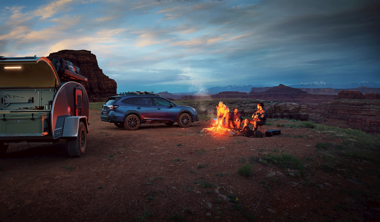 2025 Subaru Outback driving on a wet mountain road