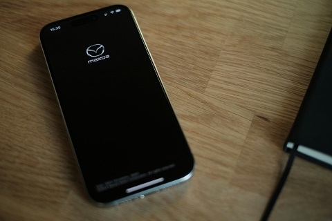 cell phone with the MyMazda app open