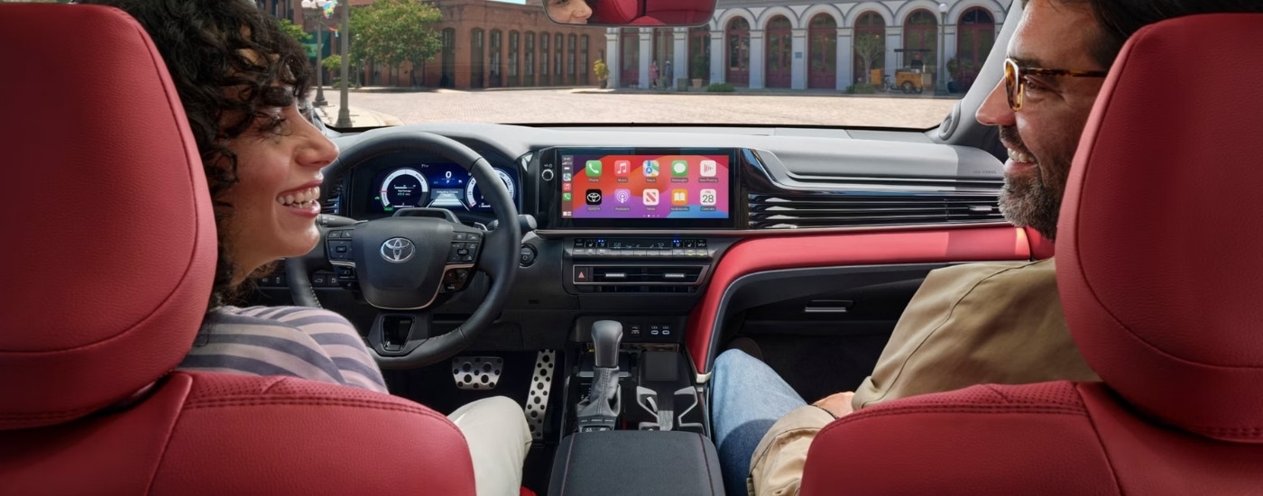 The red interior of a 2025 Toyota Camry.