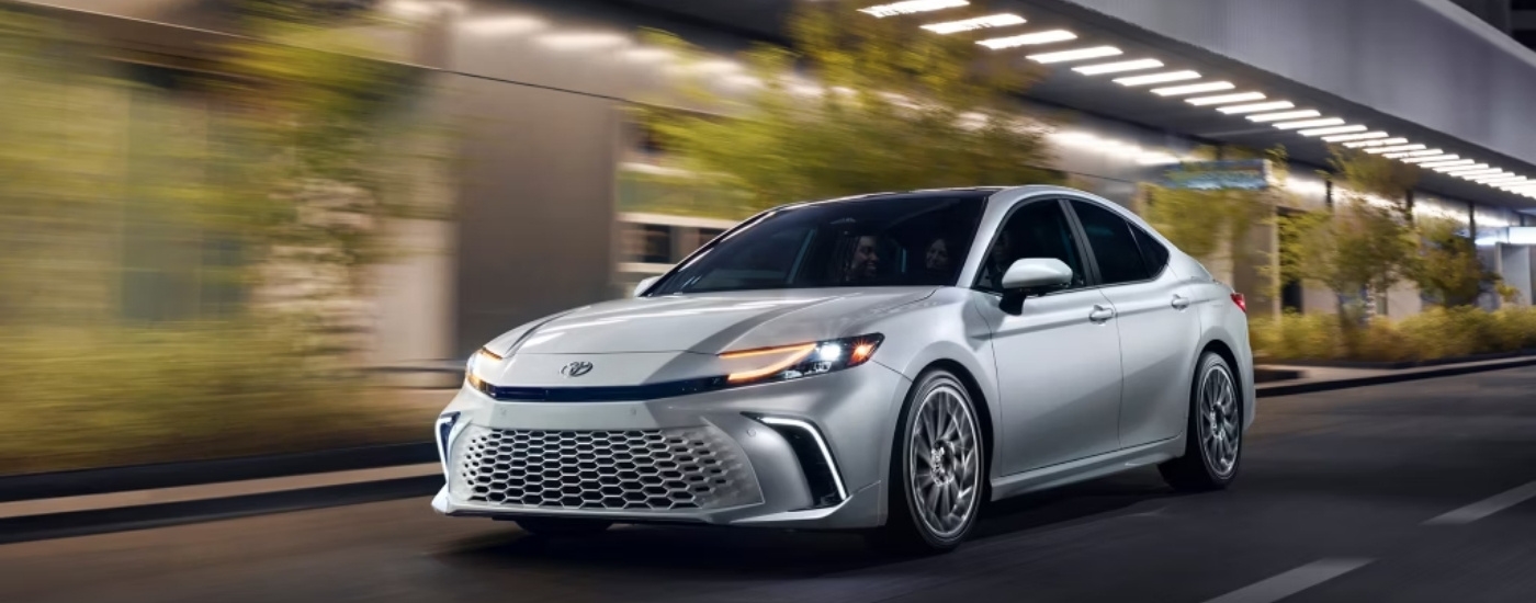 A white 2025 Toyota Camry for sale near Ardsley from the front.