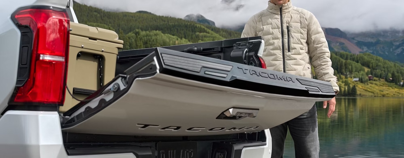 A white 2025 Toyota Tacoma from behind.