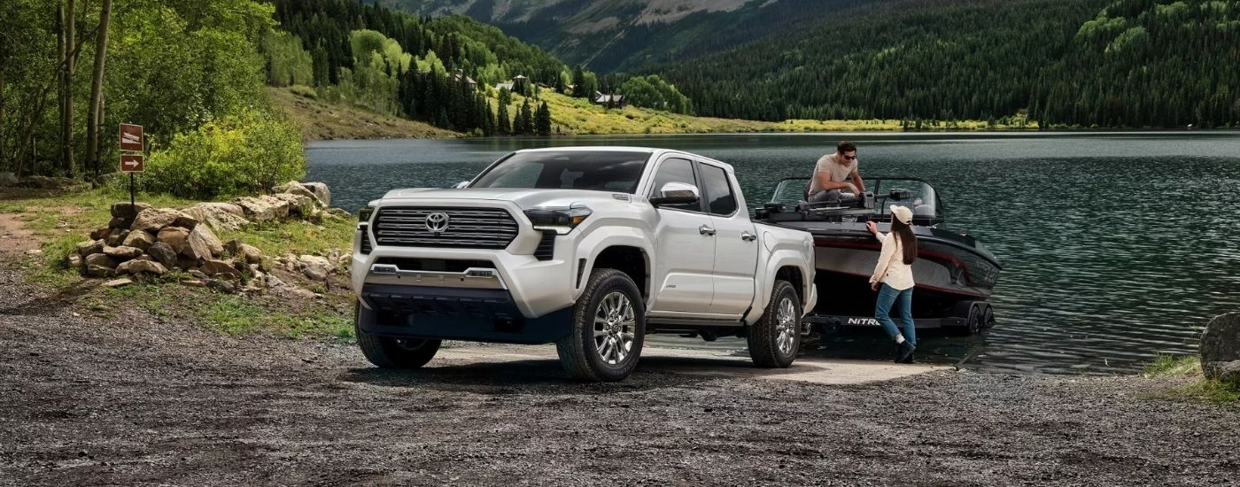 A white 2025 Toyota Tacoma on a boat launch.