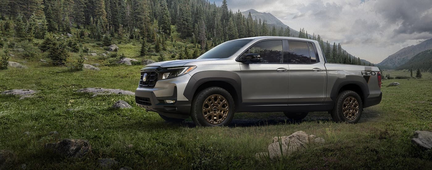A silver 2021 Honda Ridgeline from the side.