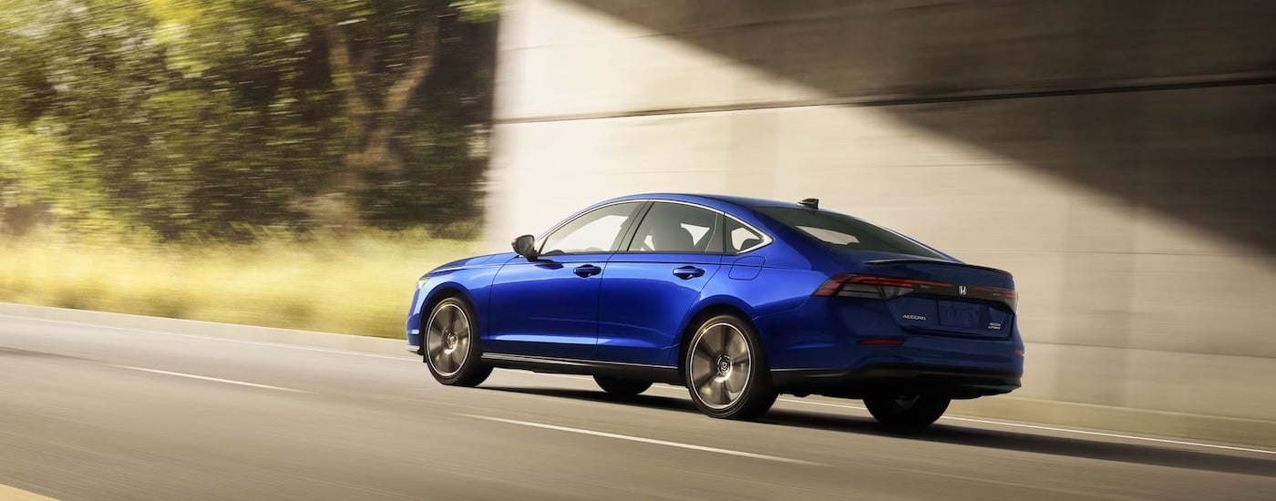A blue 2021 Honda Accord from the rear at an angle after leaving a used Honda for sale.