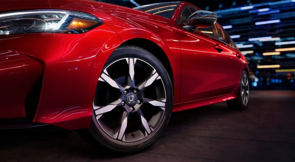 Side and tire on a red 2025 Honda Civic Touring for sale near Seattle