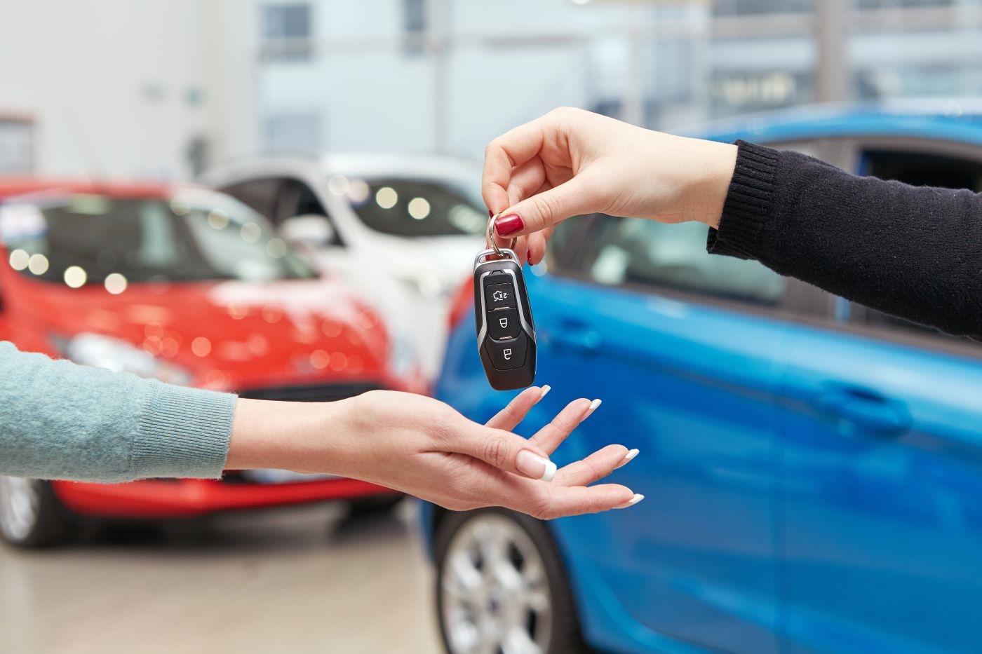 Customer handing over car keys at Mazda of Wesley Chapel