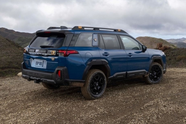 2026 Subaru Outback Wilderness coming soon to Castle Subaru McHenry parked alongside a dirt road.