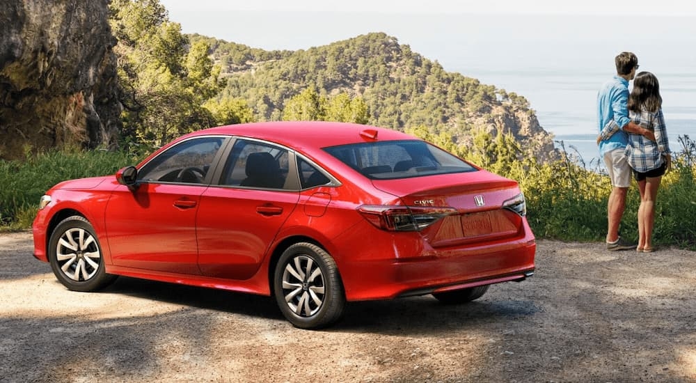 Red 2026 Honda Civic LX overlooking an ocean view