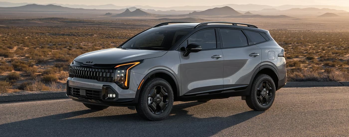Grey 2026 Kia Sportage for sale near Spring parked on an open road