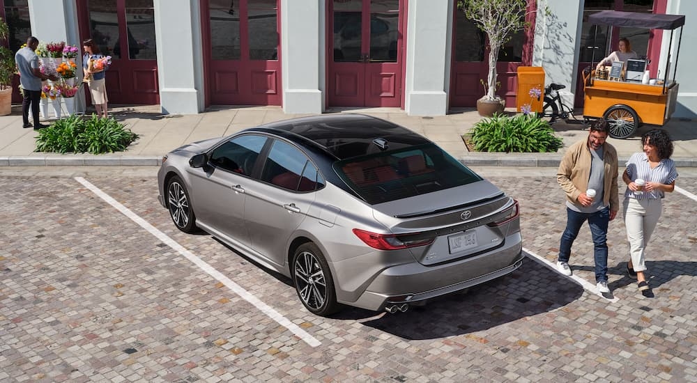 Grey 2025 Toyota Camry parked on a parking lot.