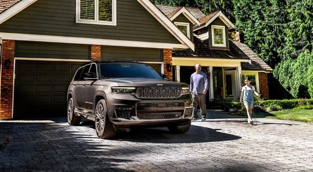 A grey 2024 Jeep Grand Cherokee from the front at an angle.