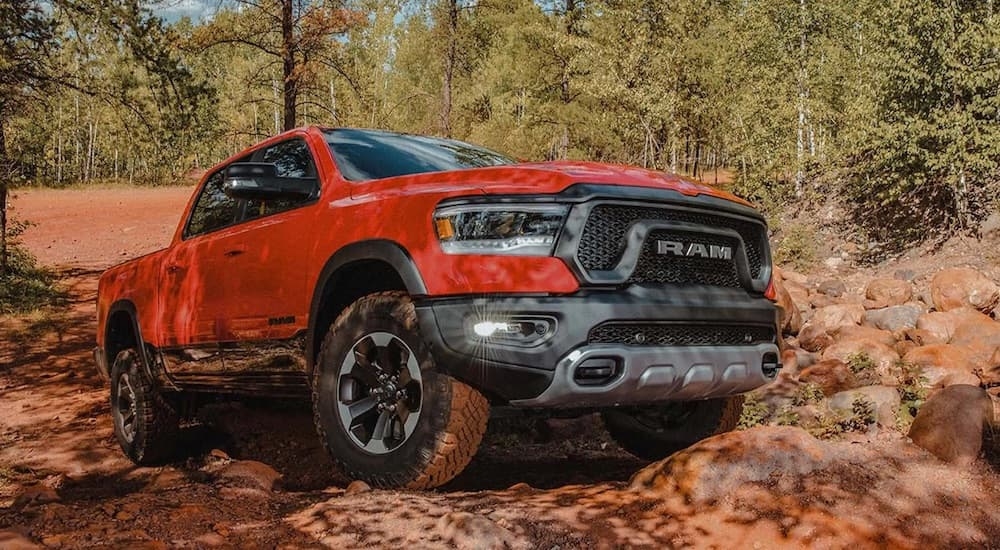 A red 2022 Ram 1500 from the front at an angle after the owner researched how to 'sell my car'.