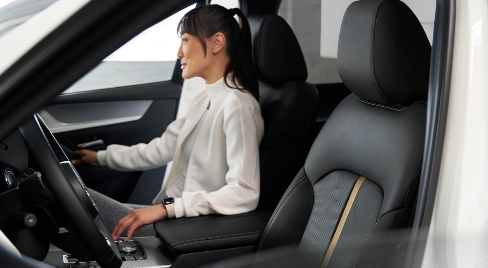 A person sitting a 2025 Mazda CX-70 PHEV.