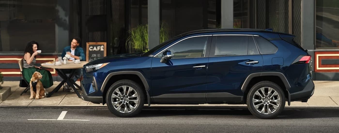 A blue 2025 Toyota RAV4 hybrid for sale near Keene is parked.