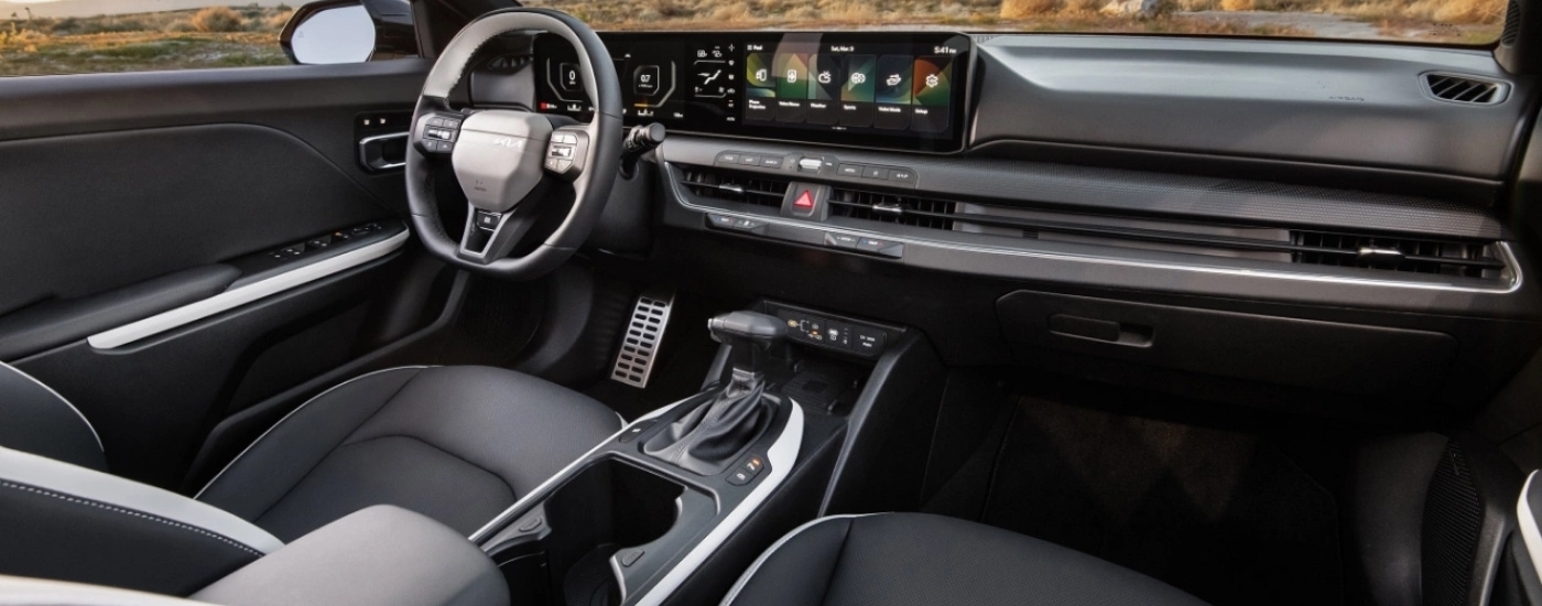 Black dash and interior in a 2025 Kia K4.