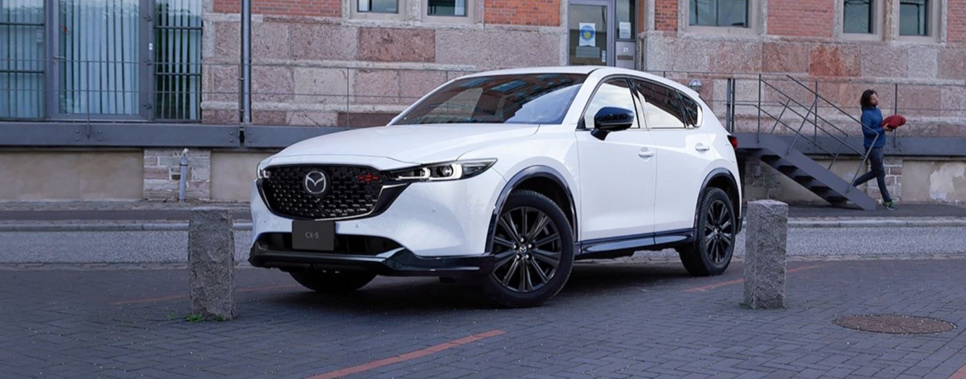 White 2025 Mazda CX-5 for sale near Hialeah parked near a building.