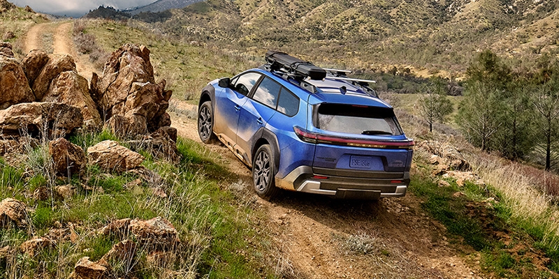 The 2026 Subaru Trailseeker EV SUV on an offroad trail. Coming soon to Castle Subaru McHenry.