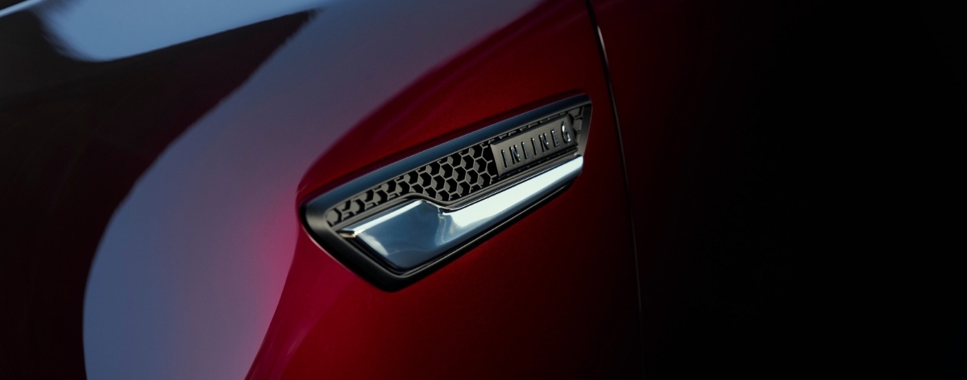 Inline 6 badge on a purple 2024 Mazda CX-90 for sale near Coral Gables.