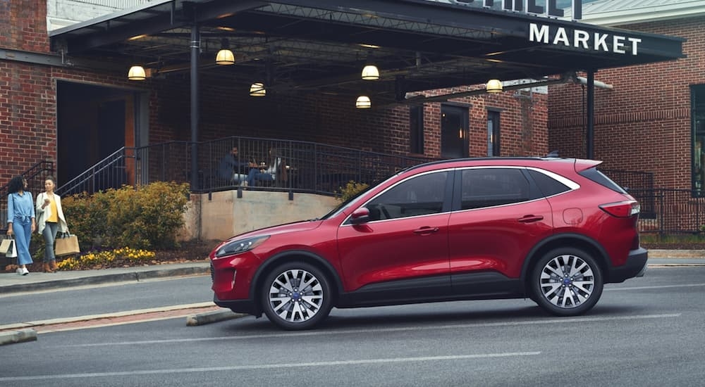 Red 2020 Ford Escape parked near a market after visiting a used car dealer in Rhinebeck.