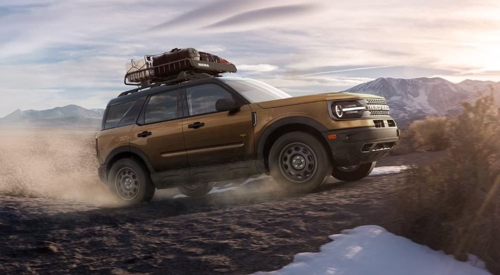 Bronze 2022 Ford Bronco Sport driving off-road.