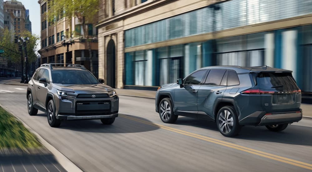Two 2026 Toyota RAV4 driving on a city street
