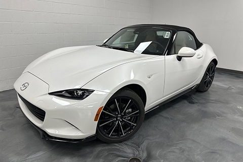 white 2025 Mazda Miata convertible sedan parked at the Bountiful Mazda dealership in Bountiful, UT