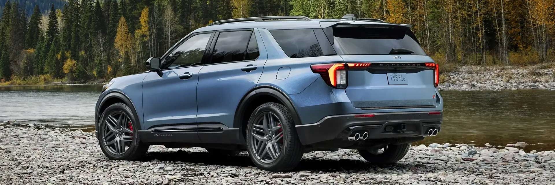2025 Ford Explorer parked next to a lake
